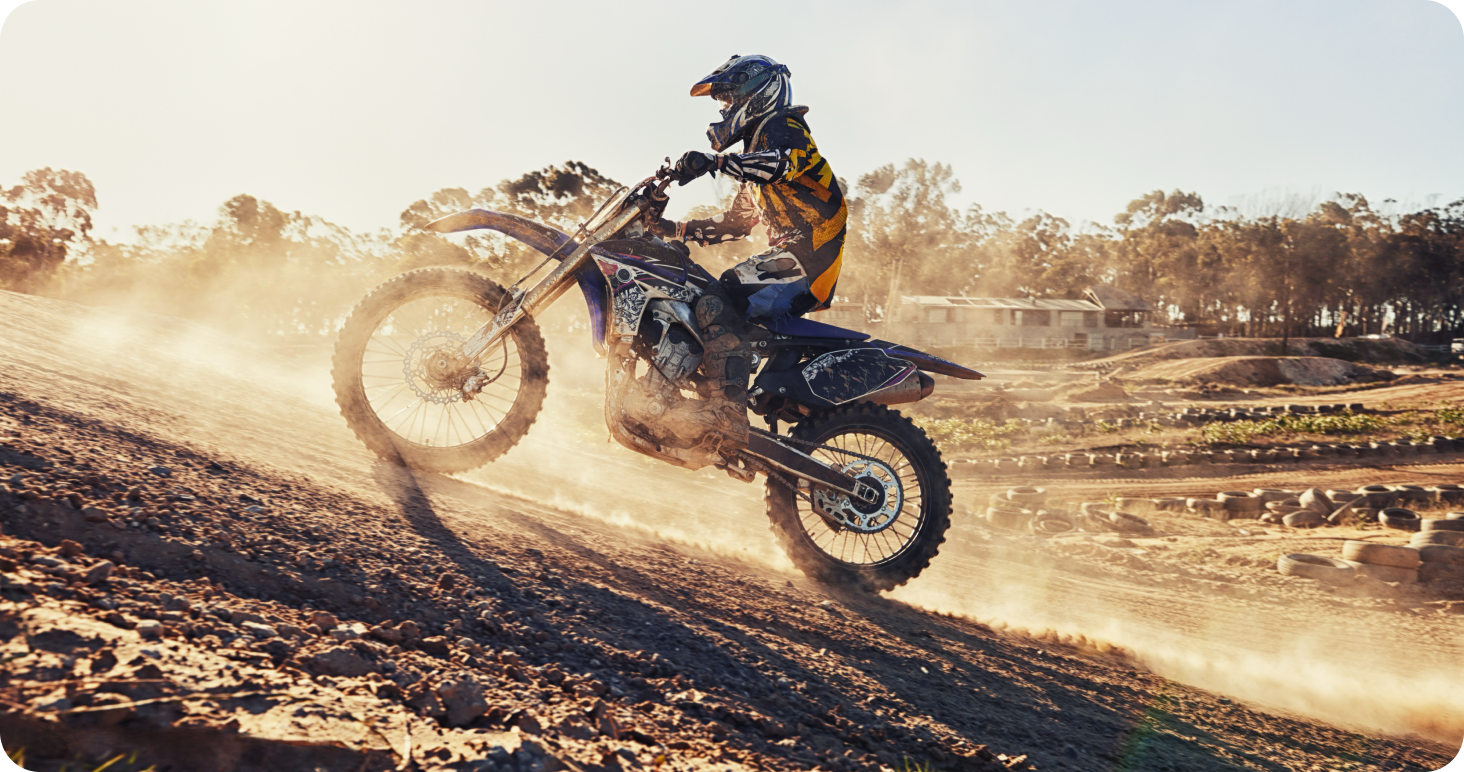 Man off-roading on a bike through rough terrain