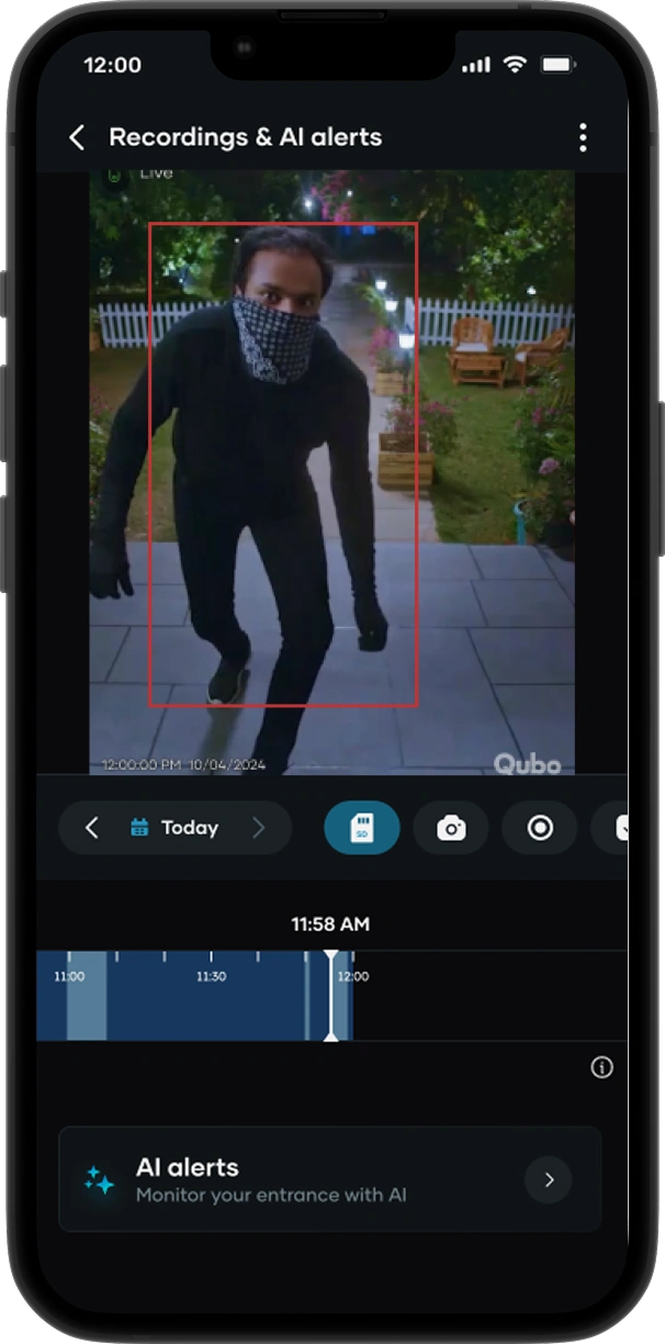 Image of a thief at the doorstep highlighted with a red detection box on a phone screen