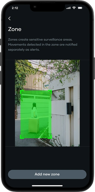 Image of phone screen showing a girl standing outside a home with a green box highlighting a marked zone
