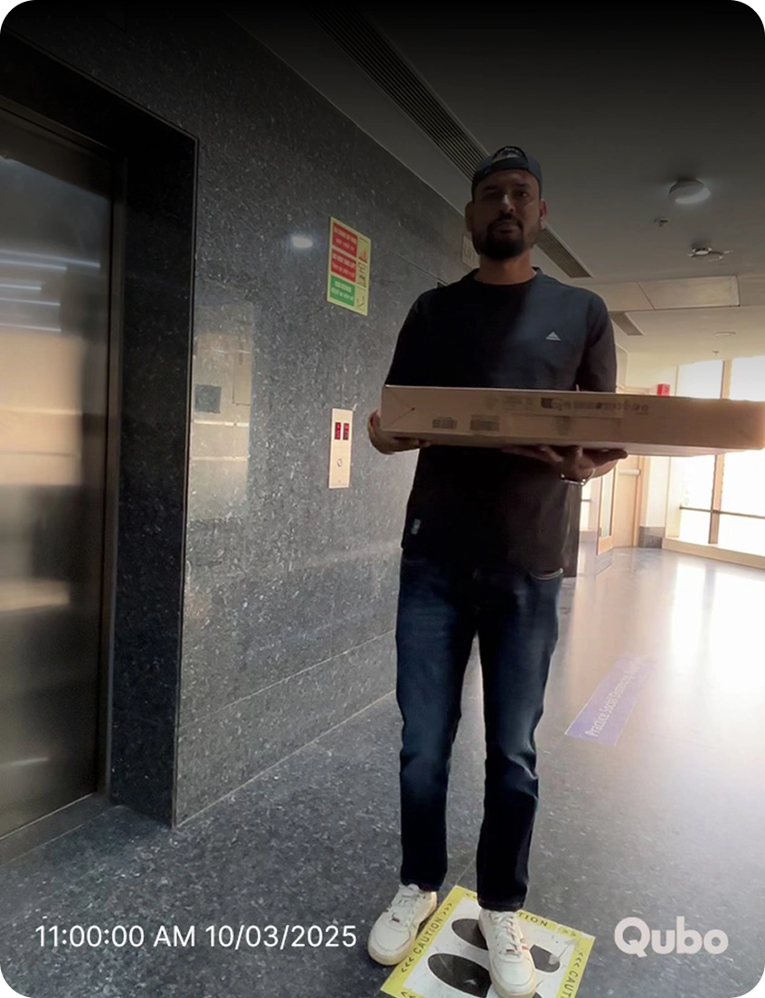 Image of a man with a parcel at the doorstep